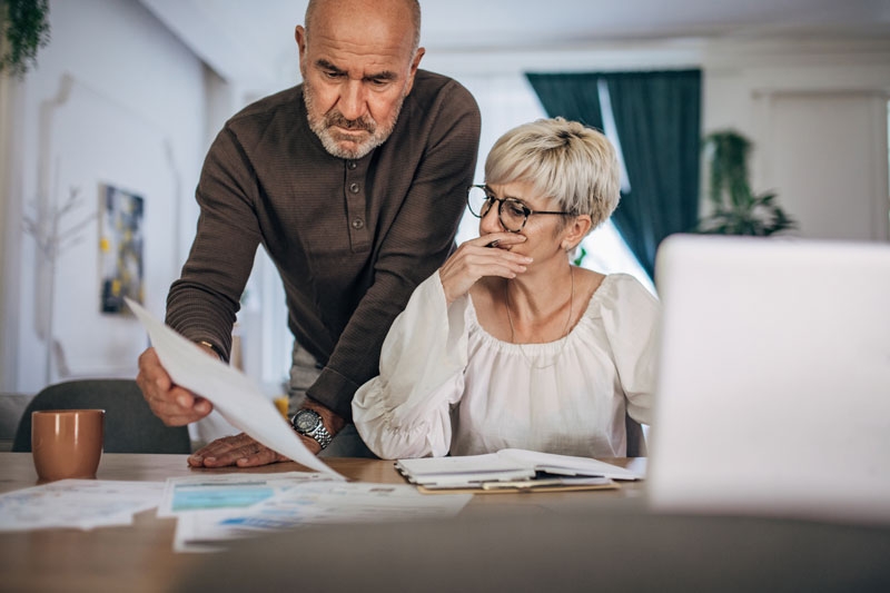 Husband and wife review paperwork